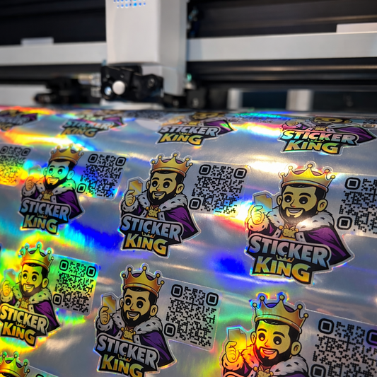 Holographic stickers with 'Sticker King' branding on a reflective surface.